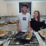 Balazs and Norah making special pizza for Kahlil's birthday.